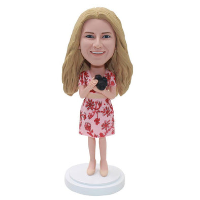 Custom Bobble Head Wearing Shorts With Camera, Custom Girl In Skirt Bobblehead Holding Camera - Abobblehead.com